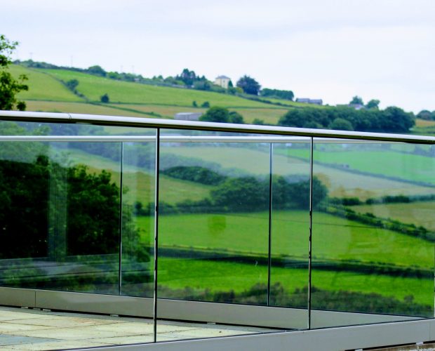Aluminox Frameless glass balustrade around a patio area in Cornwall