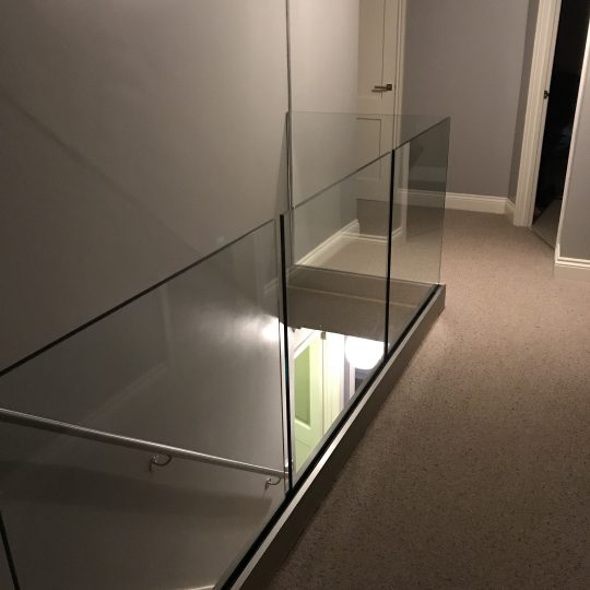 glass balustrade on a landing area in London
