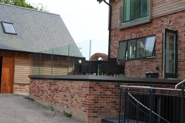 Balustrades Solus system installed on a patio for frameless glass balcony