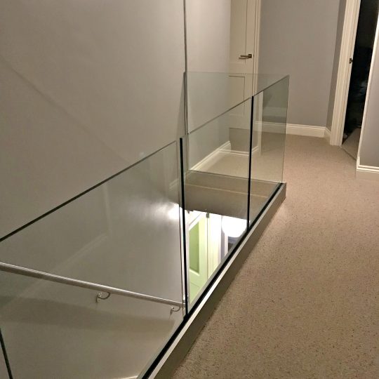 our Solus system on landing area glass balustrade